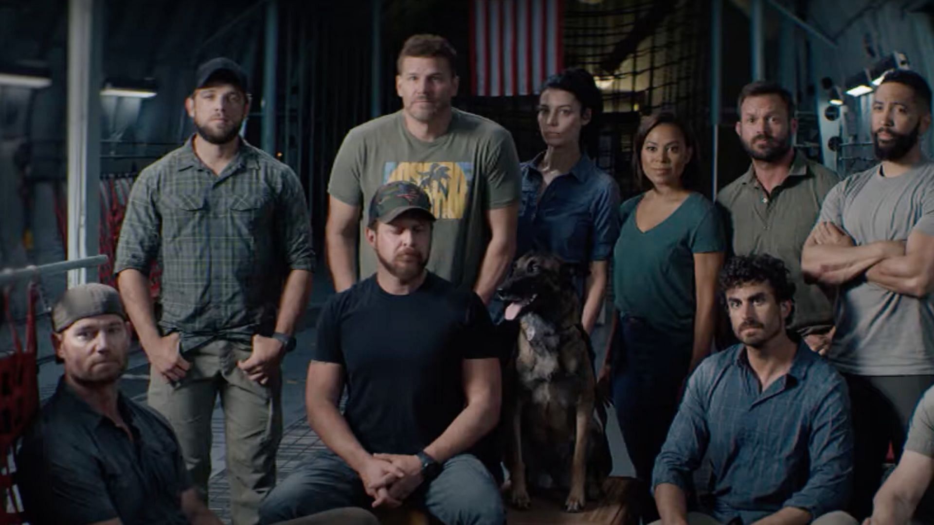 Scott Foxx (Bottom left) with the cast of SEAL Team (Image via YouTube/Paramount Veterans Network)